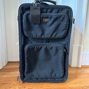 Gucci back pack and rolling luggage travel set